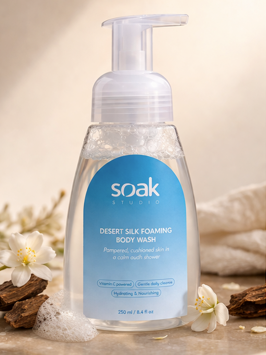 Soak Studio Desert Silk Foaming body wash bottle with blue label on a neutral background