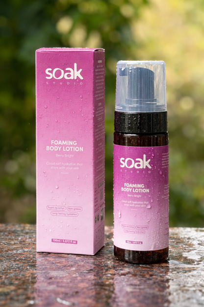 Soak Studio Foaming body lotion with water drops and a blurred background
